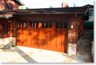 The stained mahogany Craftsman garage door