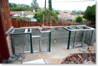 Barbecue island structure framed out in aluminum and steel