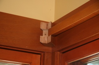 Corner curtain rod bracket installation