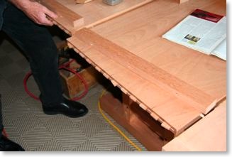 Craftsman mahogany and ebony table. The edge is attached with many biscuits and adhesive.