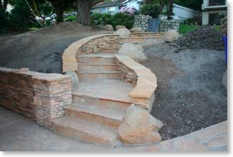 Craftsman walkway in front yard made of stone.