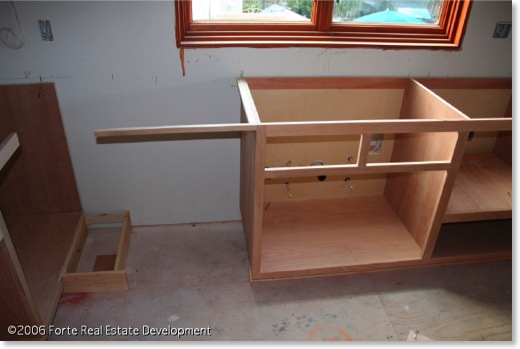 Kitchen sink cabinet is off center.