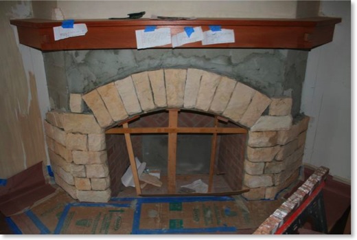 The Moonlight flagstone is being installed on the living room fireplace.