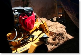 The stump grinder was brought in to remove the stump at least 1 foot below the grade.