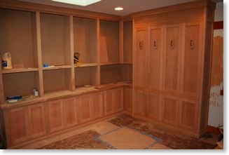 Unfinished library cabinets with built-in Murphy bed.