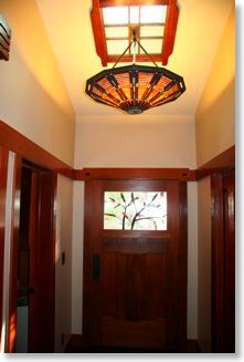 Craftsman Front Door with Stained Glass Window and Chandelier in Entry